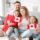 A happy family holding Canadian flags