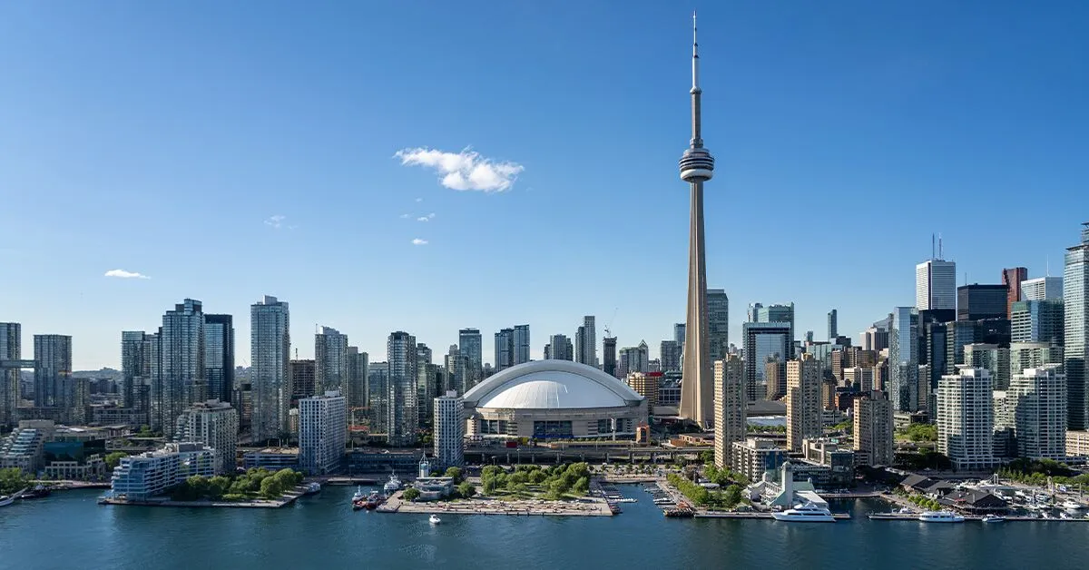 Toronto's skyline looking north from Lake Ontario, with the CN Tower and SkyDome prominent in the foreground